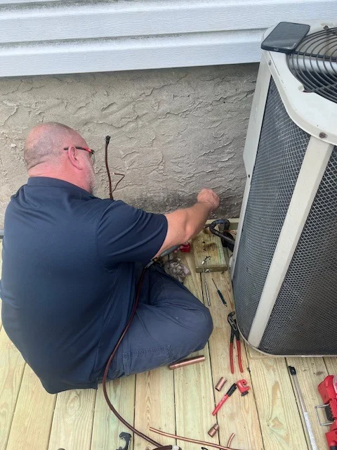 Air conditioning equipment being serviced