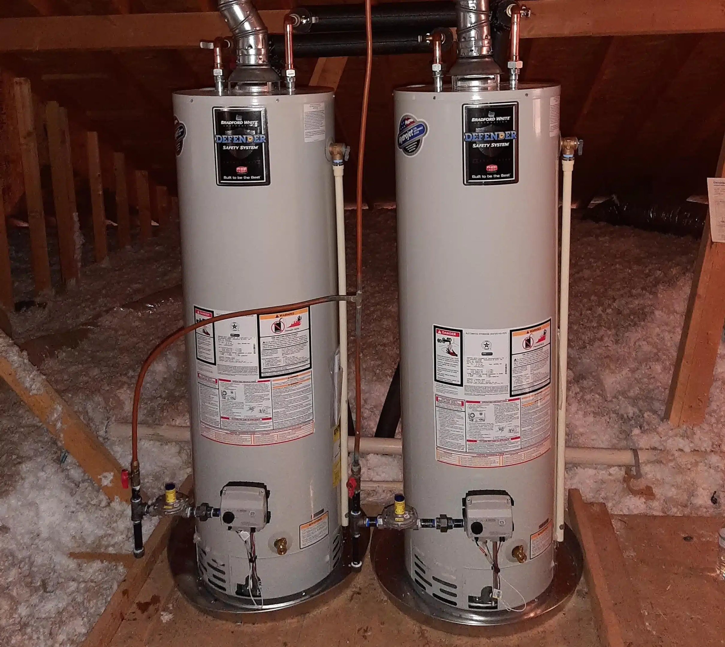 Two tank water heaters with venting and pipework